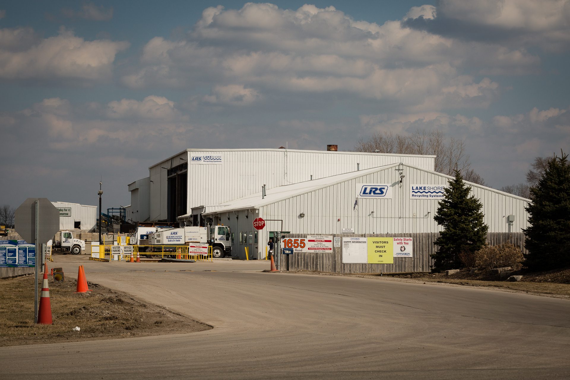 Lakeshore Recycling Systems white building with trucks pulled in