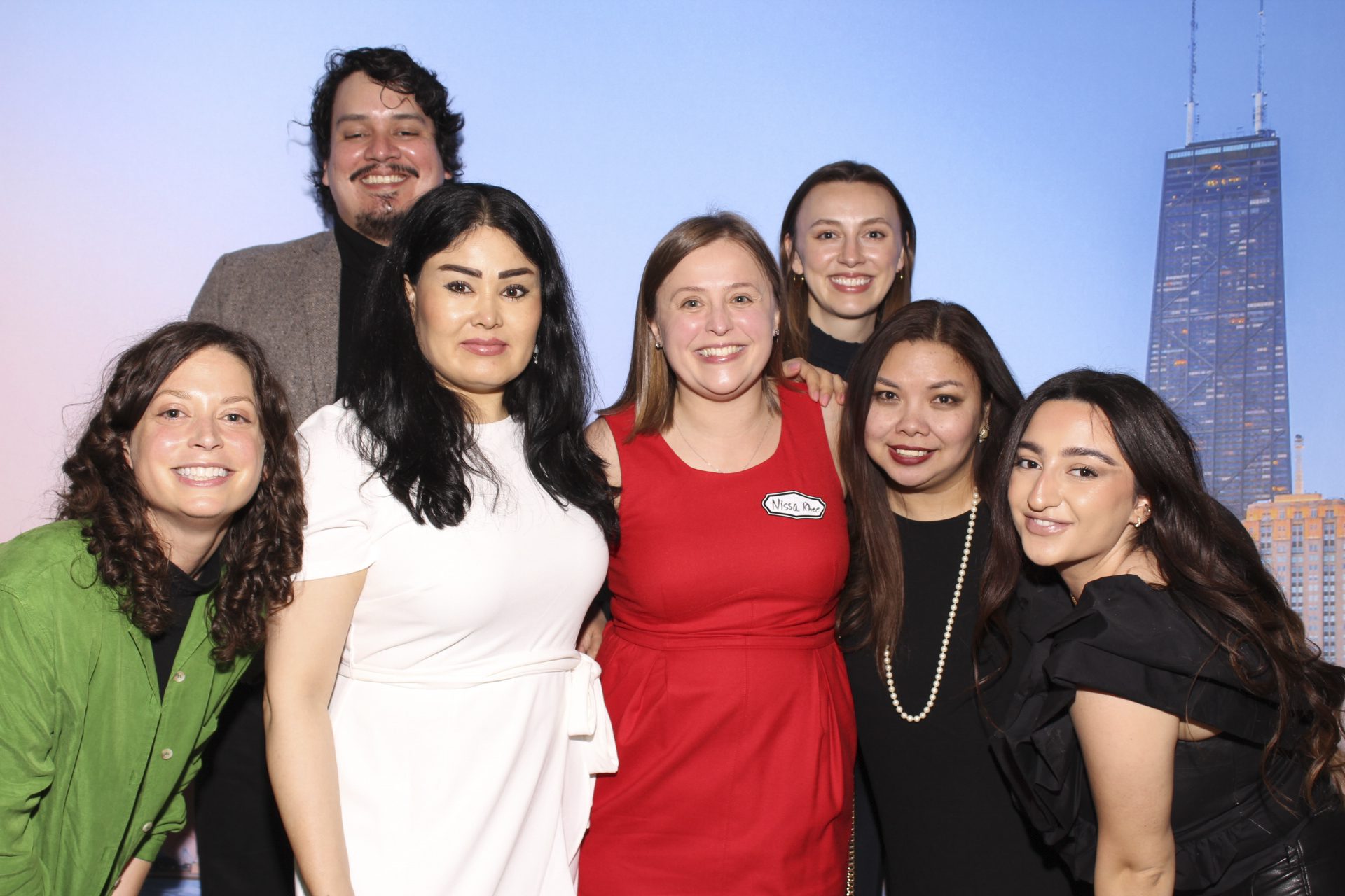 Borderless Magazine team members Michelle Kanaar, Mike Centeno, Saleha Soadat, Nissa Rhee, Chelsea Verstegen, Jen Montojo and Diane Bou Khalil with the Chicago skyline behind them