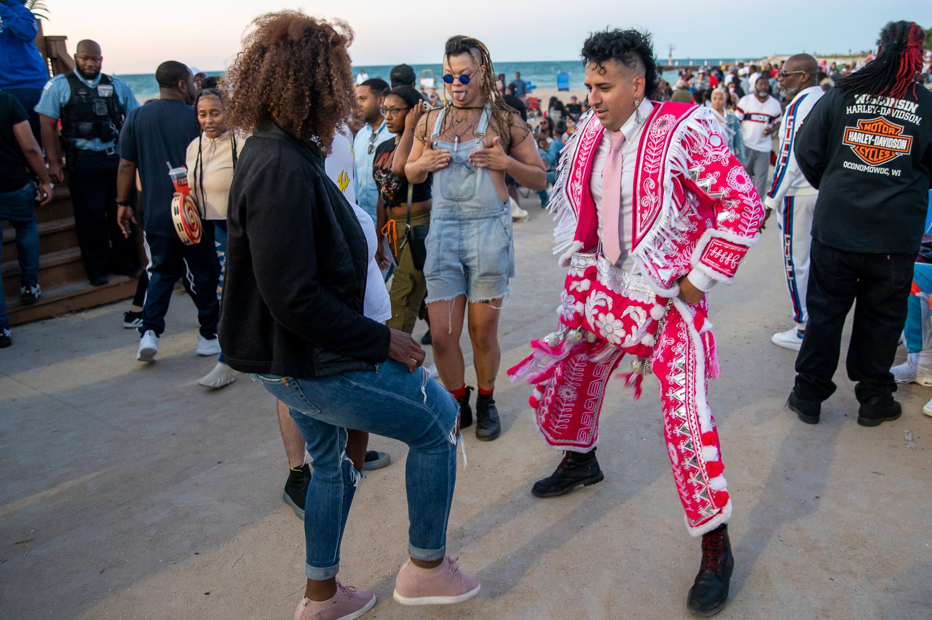 Ebony Chamber dances with J Saxon during a house music event by the lake